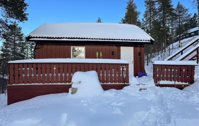 a building covered in snow with a pile of snow around it at 2 Bedroom Pet Friendly Home In Rendalen in Rendalen