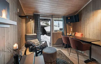 a room with a table and chairs and a desk at Amazing Apartment In Hovden I Setesdal in Hovden