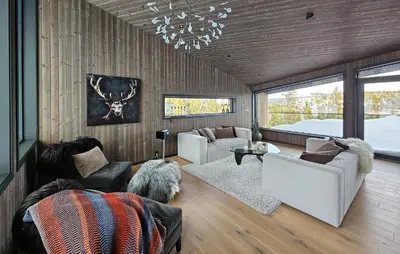 a living room with a couch and chairs and a chandelier at Awesome Home In Rjukan With Sauna in Rjukan