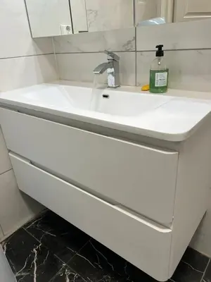 a white bathroom sink with a bottle of soap on it at Gjestehus i Trondheim, under VM 2025 in Trondheim
