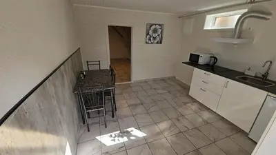 an overhead view of a kitchen with a table and chairs at Apartment in Rauma in Veblungsnes