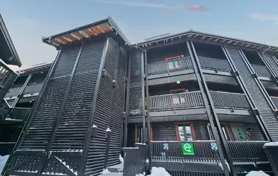a metal building with balconies on the side of it at 5 Bedroom Cozy Apartment In Ustaoset in Ustaoset