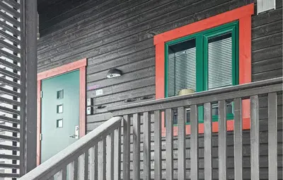 a house with a door and a window on it at 5 Bedroom Cozy Apartment In Ustaoset in Ustaoset