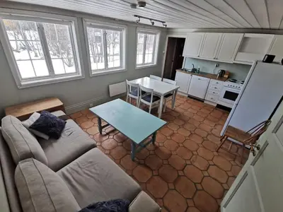 a living room with a couch and a table at Hemsedal - 2 bedrooms - WI-FI in Hemsedal