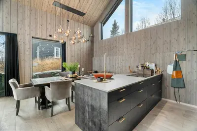 a kitchen with a large island in the middle at Family Cabin At The Foot Of Gaustatoppen in Rjukan