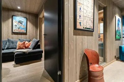 a living room with a couch and a chair at Family Cabin At The Foot Of Gaustatoppen in Rjukan