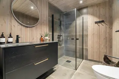 a bathroom with a shower and a sink and a toilet at Family Cabin At The Foot Of Gaustatoppen in Rjukan