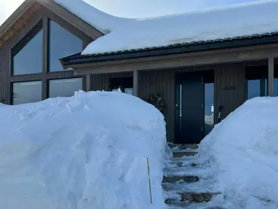 a pile of snow in front of a house at Family Cabin At The Foot Of Gaustatoppen in Rjukan