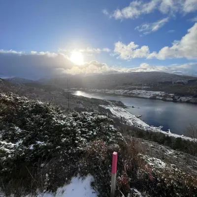 a view of a river with snow on the ground at Apartment by the fjord, with boat and jacuzzi included in Larsnes