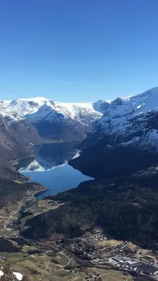 an aerial view of a lake with snow covered mountains at Lovely apartment in beautiful Loen in Loen
