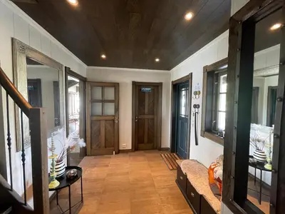 a hallway with a wooden ceiling and a door at Mountain Retreat Near Hiking And Skiing in Beitostøl