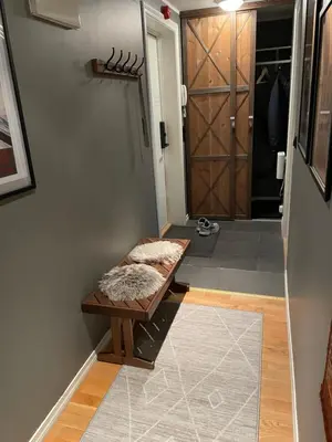 a hallway with a dog bed in front of a door at Geilo Gaarden - Geilo sentrum in Geilo