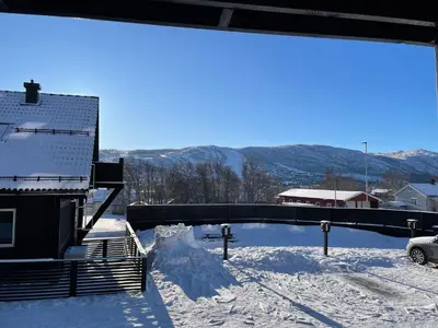 a view of a snow covered area with a bridge at Geilo Gaarden - Geilo sentrum in Geilo