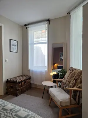 a living room with a couch and a window at Unique apartment in midtown in Trondheim