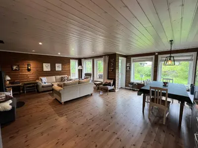 a living room with a couch and a table at New Cozy Cabin By Ski Trails And Nature Paths in Beitostøl