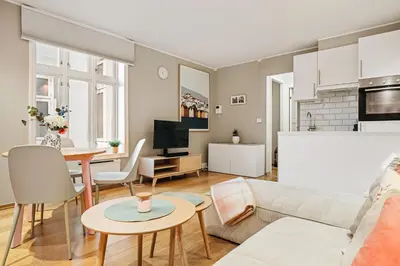 a living room with a couch and a table at Bergens Nr1 smau I Enkel innsjekk I Sjøutsikt in Bergen