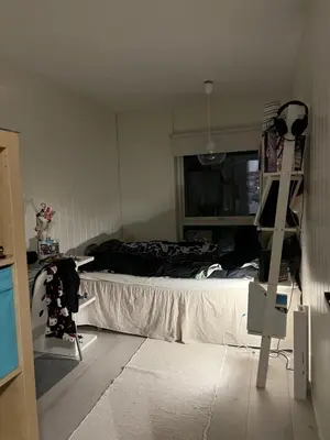 a bedroom with a bed and a ladder in it at Koselig rekkehus til leie under ski VM i Trondheim in Trondheim
