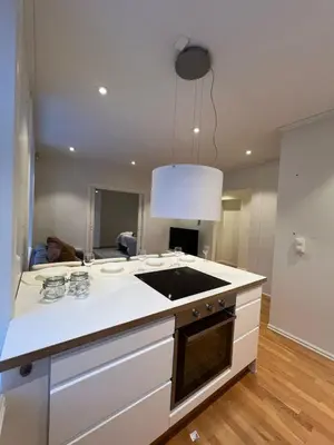 a kitchen with a sink and a stove top oven at Apartment near City Center in Trondheim
