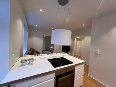a kitchen with a white counter top in a room at Apartment near City Center in Trondheim