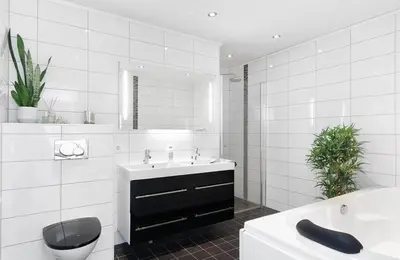 a white bathroom with a sink and a mirror at 4 roms leilighet ved Fosshaugane Campus in Sogndal