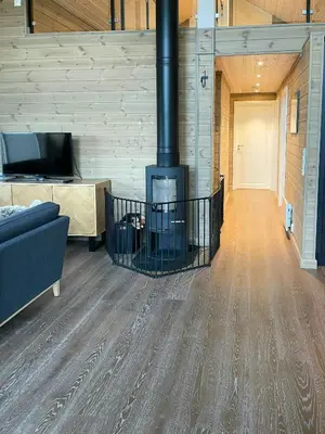 a living room with a fireplace and a couch at Modern Cabin At The Gateway To Jotunheimen in Randsverk