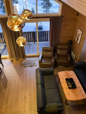 a living room with a couch and a table at Modern Cabin At The Gateway To Jotunheimen in Randsverk