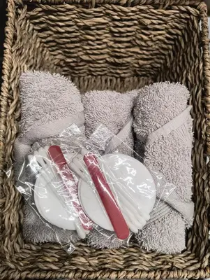 a basket filled with dishes and towels at Rancho Apartment in Langevåg in Sula
