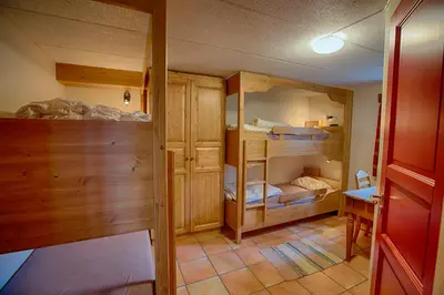 a room with several bunk beds in a room at Large Cabin With Stunning Views! in Beitostøl
