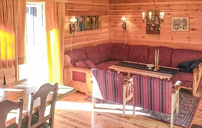 a living room with a couch and a table and chairs at Beautiful Home In Rjukan With Wifi in Rjukan