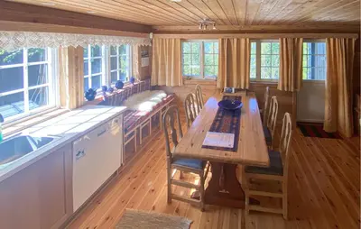 a dining room with a long table and chairs at Beautiful Home In Rjukan With Wifi in Rjukan