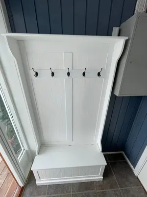 a white closet with four black birds on it at Leilighet i Sør-Fron kommune in Sør-Fron