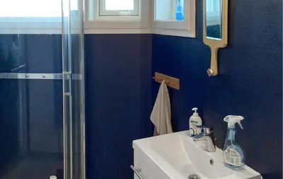 a bathroom with a sink and a shower at Lovely Home In Flaktveit With Wifi in Blinde