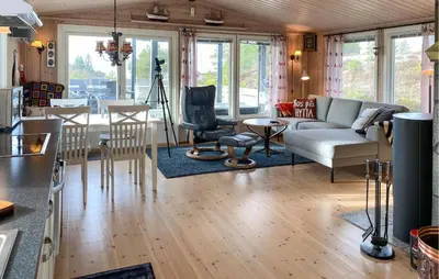 a living room with a couch and a table at 2 Bedroom Amazing Home In Agdenes in Fremstad