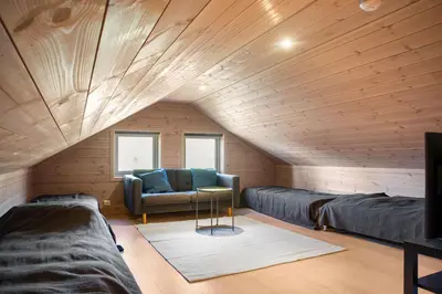 a living room with a couch and a table at Modern Family Cabin at Norefjell - Views and Hiking in Eggedal