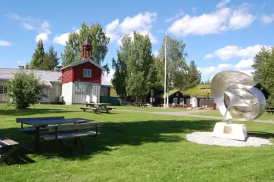 a metal sculpture in a park with a picnic table at Stor-Elvdal Hotell in Koppang