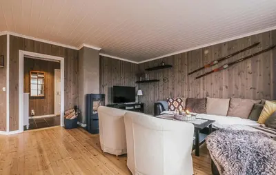 a living room with a couch and a table at Family Cabin With Ski Inout In Rauland in Rauland