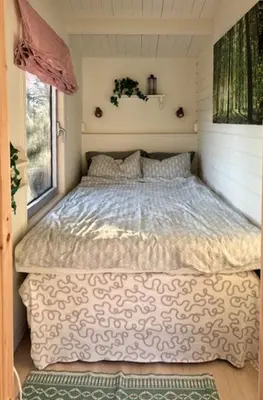a bedroom with a bed in a small room at Family Cabin With Panoramic Views Of Tyrifjorden in Nes