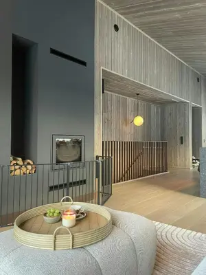 a living room with a couch and a tv at Architect Designed Mountain Cabin At Kvitfjell in Favang