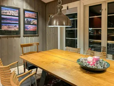 a dining room table with a bowl of candles on it at Family Cabin With Ski In Ski Out in Trysil