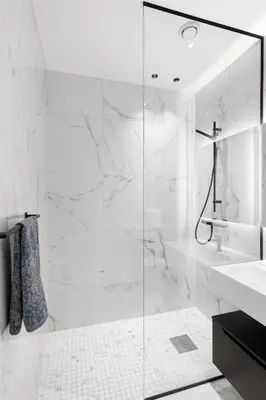 a white bathroom with a shower and a sink at High-End Villa with Private rooftop and sea line in Bergen