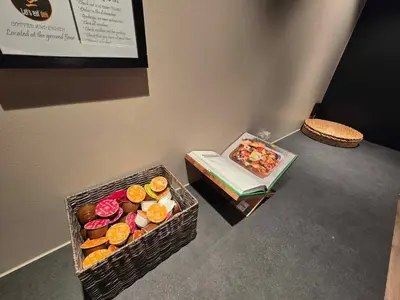 a basket of donuts and a box of donuts at Oceanview Apartment Aalesund in Ålesund