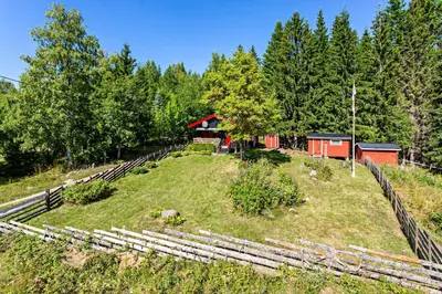a farm with a fence and a barn at Cottage w Wilderness Feeling 20 min from airport in Maura