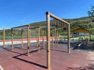 a park with a playground with wooden poles at Newly renovated cabin near Ål city center, mountains & ski resort in Liagardane