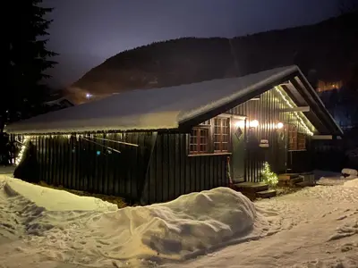 a small house with snow on the side of it at Newly renovated cabin near Ål city center, mountains & ski resort in Liagardane