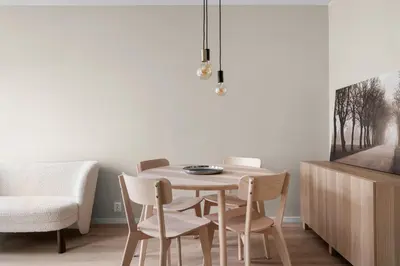 a dining room with a table and chairs and a tv at Bergen Beds Apartments I Urban Escape in Bergen