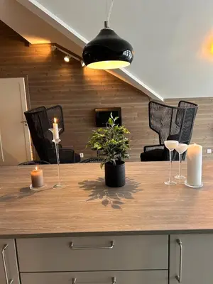 a kitchen island with two candles and a potted plant at Gorgeous apartment in Geilo in Hol