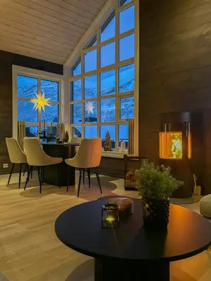 a large living room with a table and chairs at Modern Apartment At Strandafjellet Ski Resort in Stranda