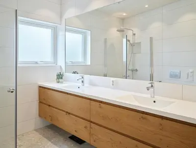 a bathroom with two sinks and a large mirror at Villa Fjord View in Stranda