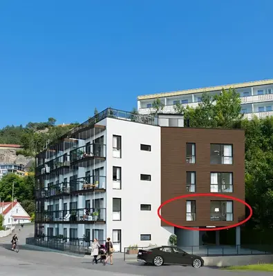 a red circle on the side of a building at Modern apartment by the sea in Bergen