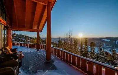 a porch of a house with a view of the mountains at Modern Cabin With Ski In-Out In Hafjell in Øyer